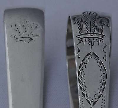Detail of motif on 2 pairs sugar tongs